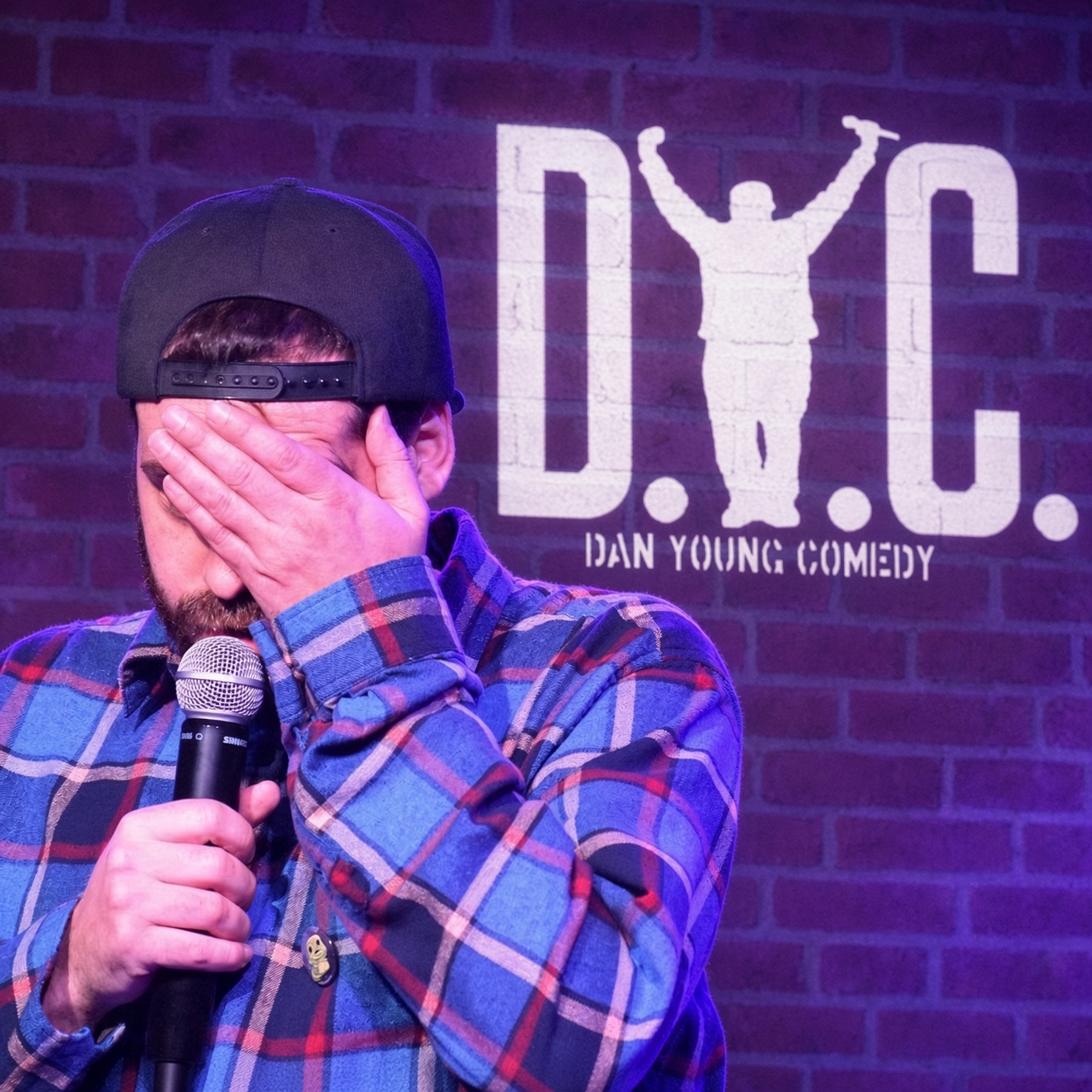 Dan Young Comedy — stage logo